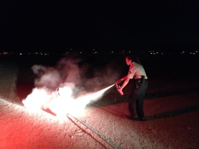 Explorer Lieutenant Purkey performing a fire extinguisher exercise